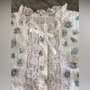 lacy small-medium white button-up top with red and blue flower bouquet pattern